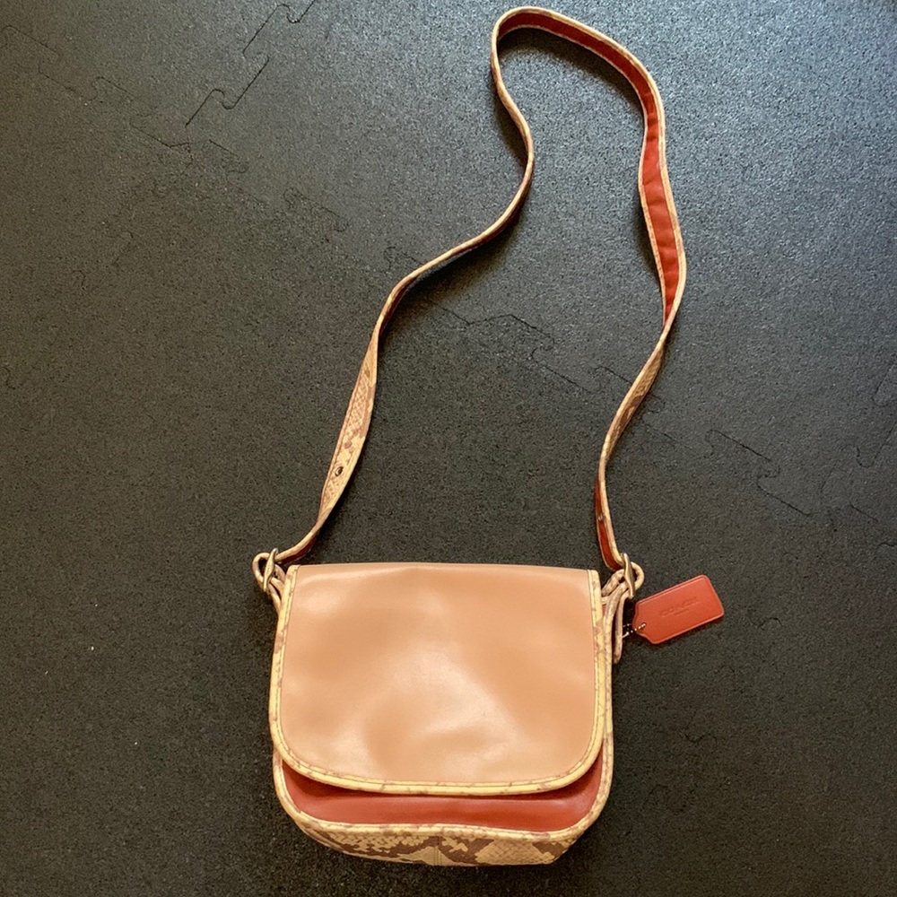 Coach purse blush color with snake print.